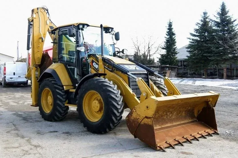 Екскаватор - навантажувач