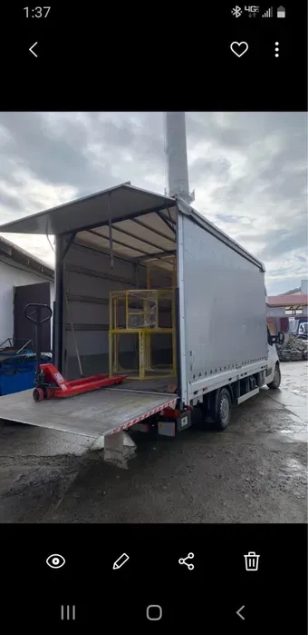 Професійні Вантажні Перевезення з Гідробортом та Роклою: Швидке Завантаження та Розвантаження Палетних Вантажів