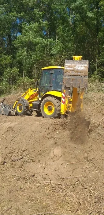 Екскаватор копаня траншеї корчування