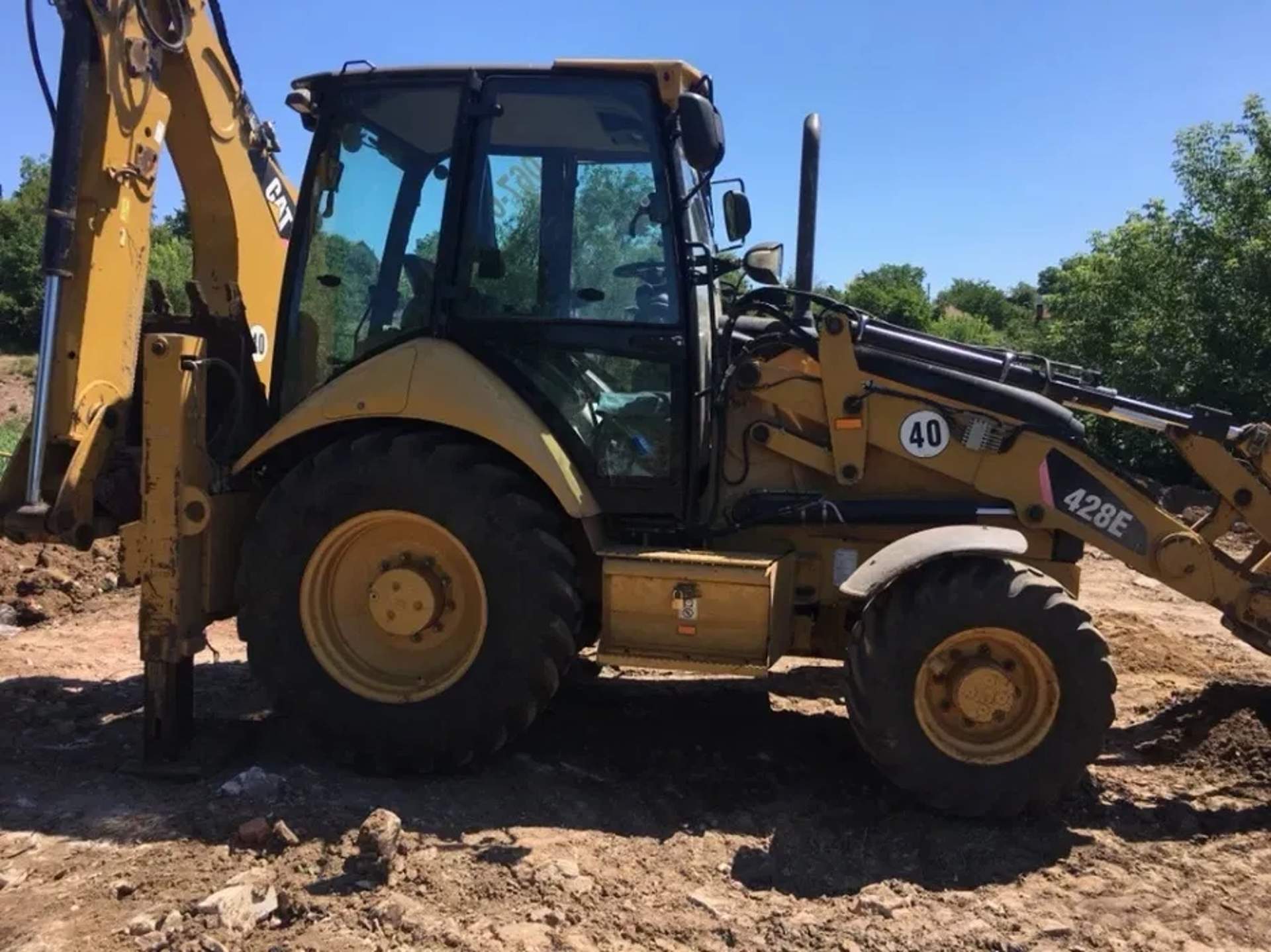 Екскаватор навантажувач CAT 428E для земляних робіт