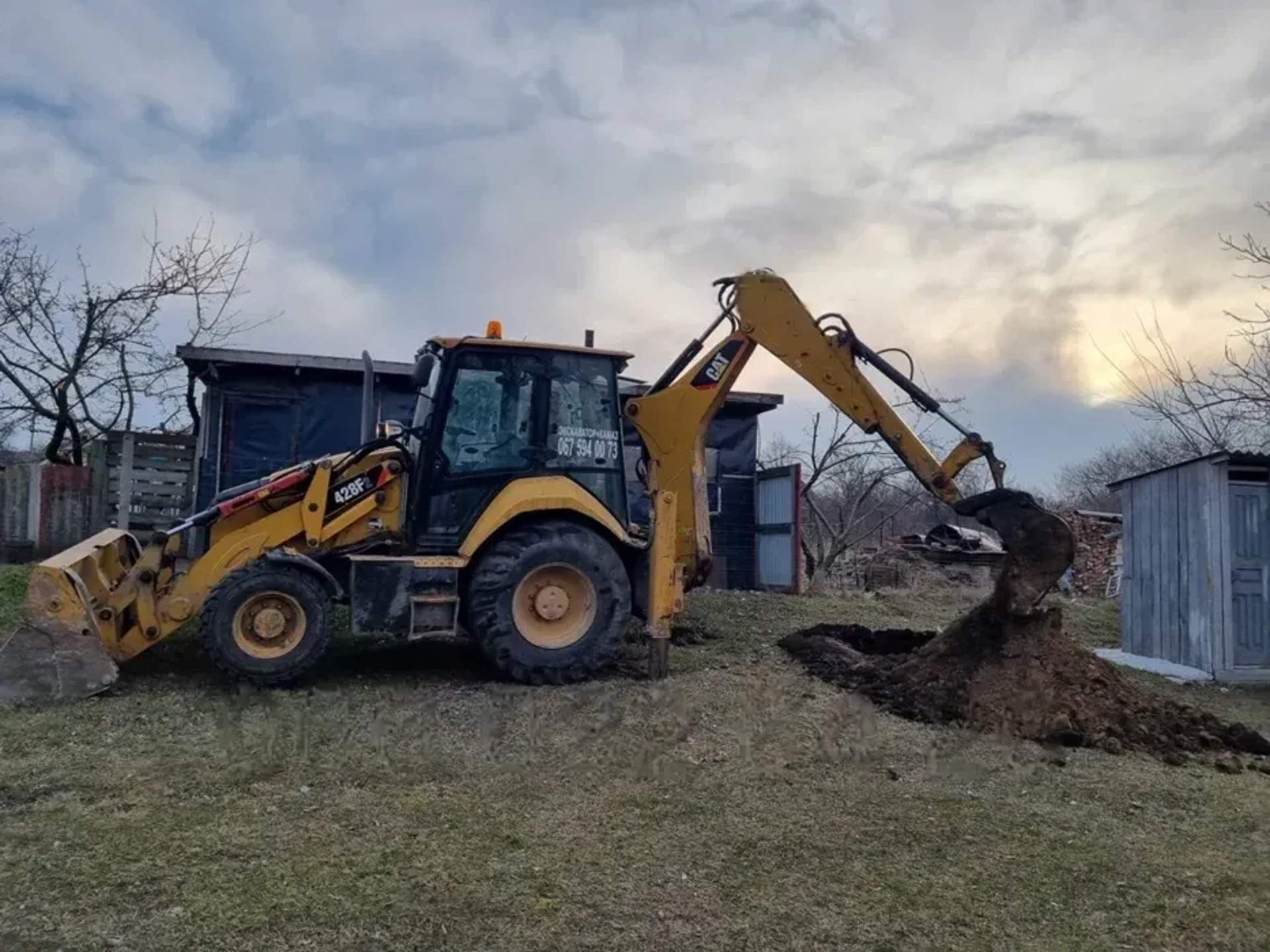 Екскаватор-навантажувач Caterpillar 428F2
