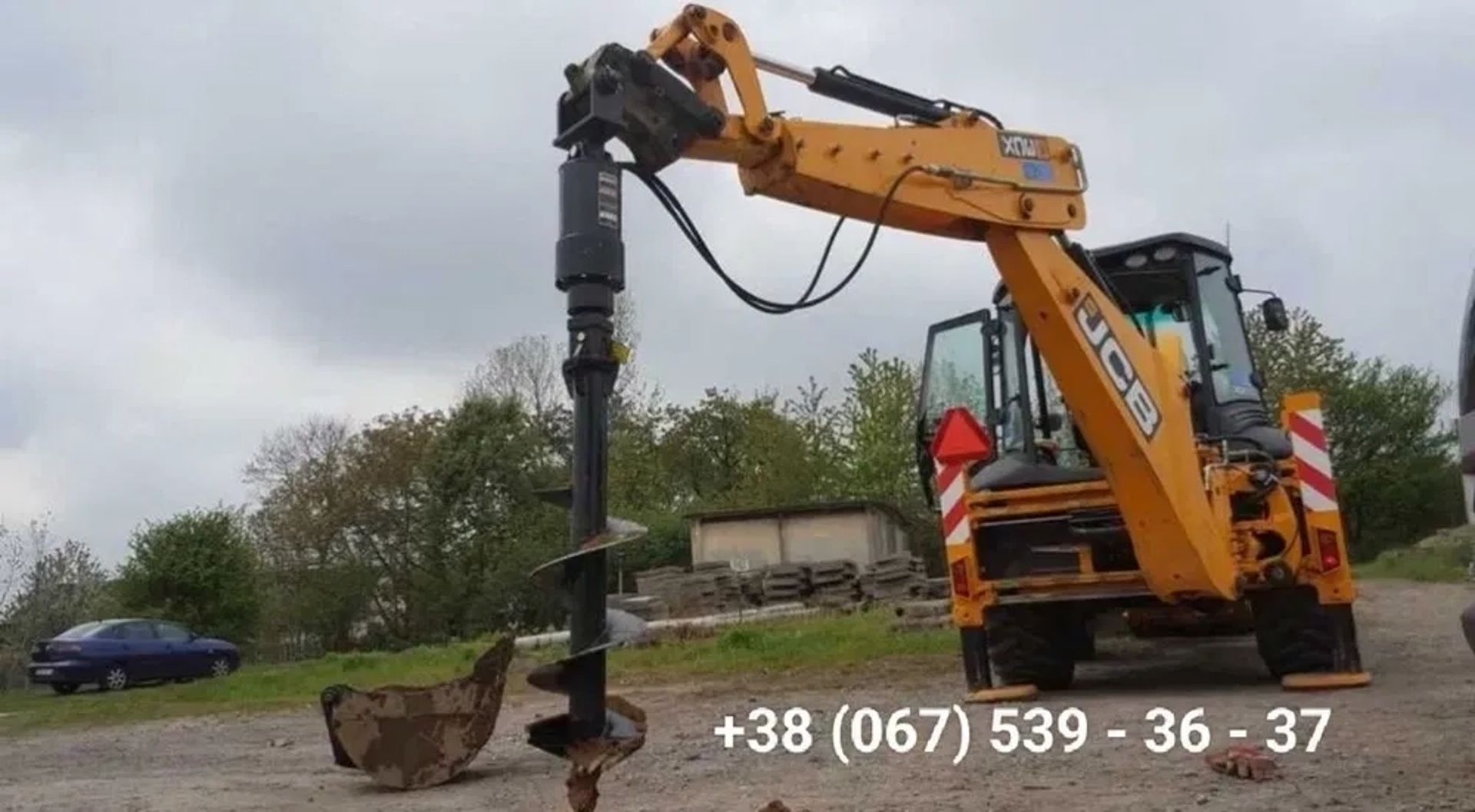 Екскаватор-навантажувач JCB 3CX з ямобуром (гідробуром)