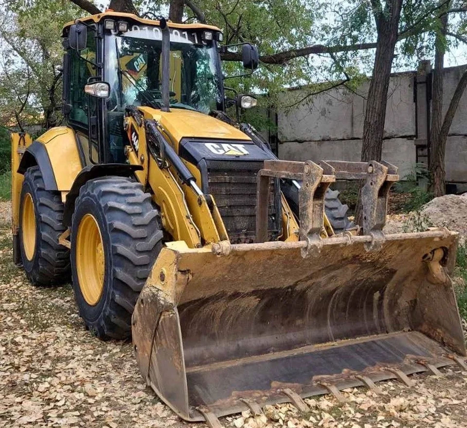 Екскаватор-навантажувач Caterpillar 444 (4х4, рівновеликі колеса)