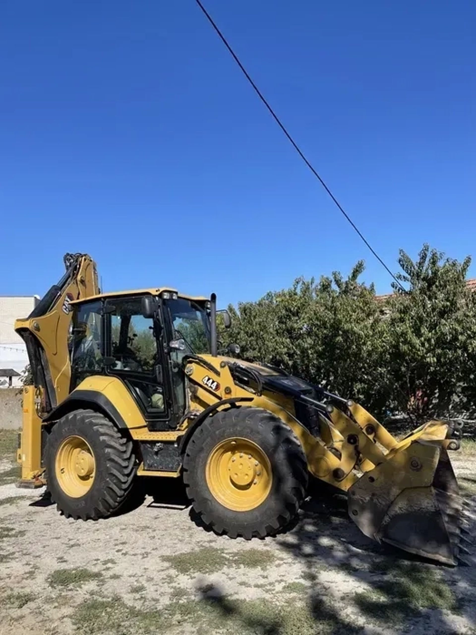 Екскаватор-навантажувач Caterpillar 444