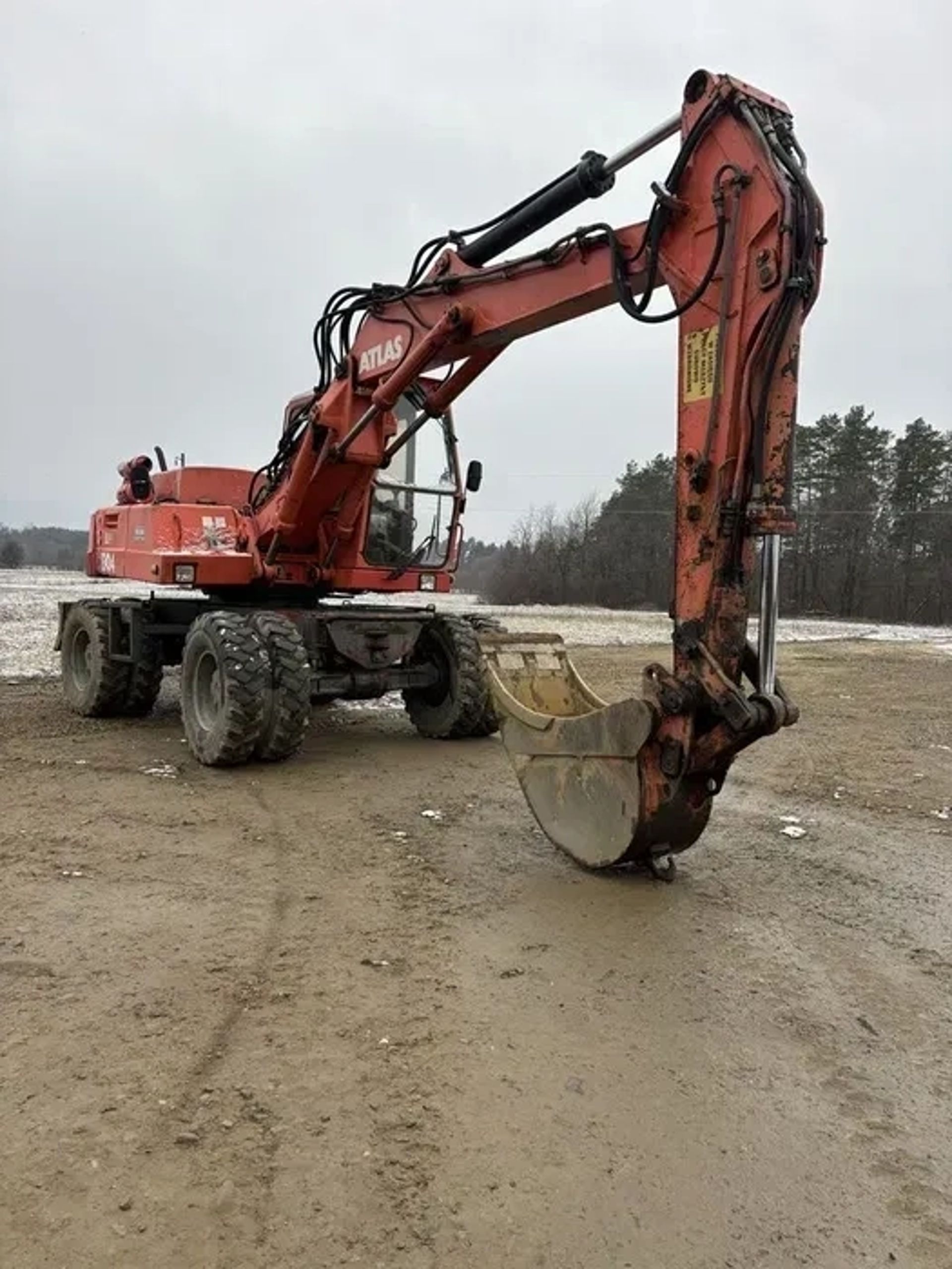 Повноповоротний колісний екскаватор Atlas Terex 1504