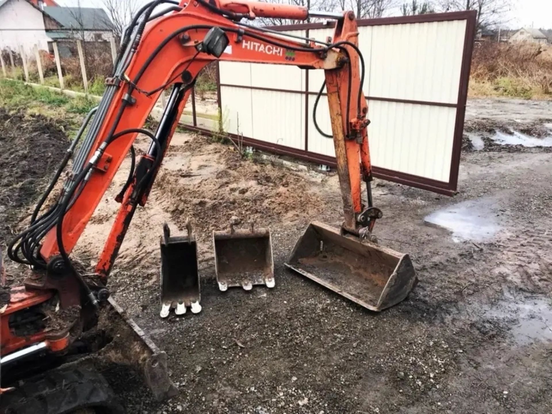 Міні - екскаватор Hitachi Construction Machinery.