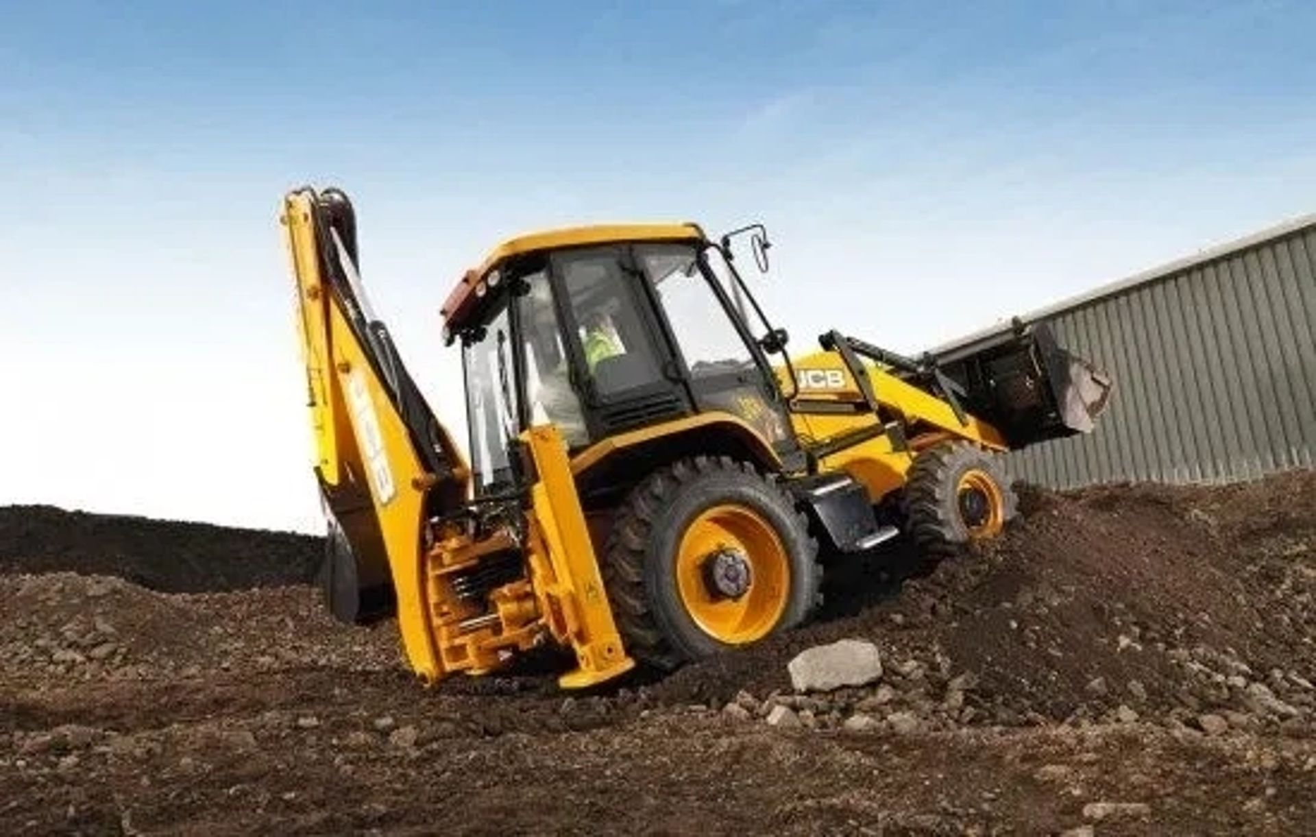 Екскаватор-навантажувач JCB 3CX для копання та навантаження