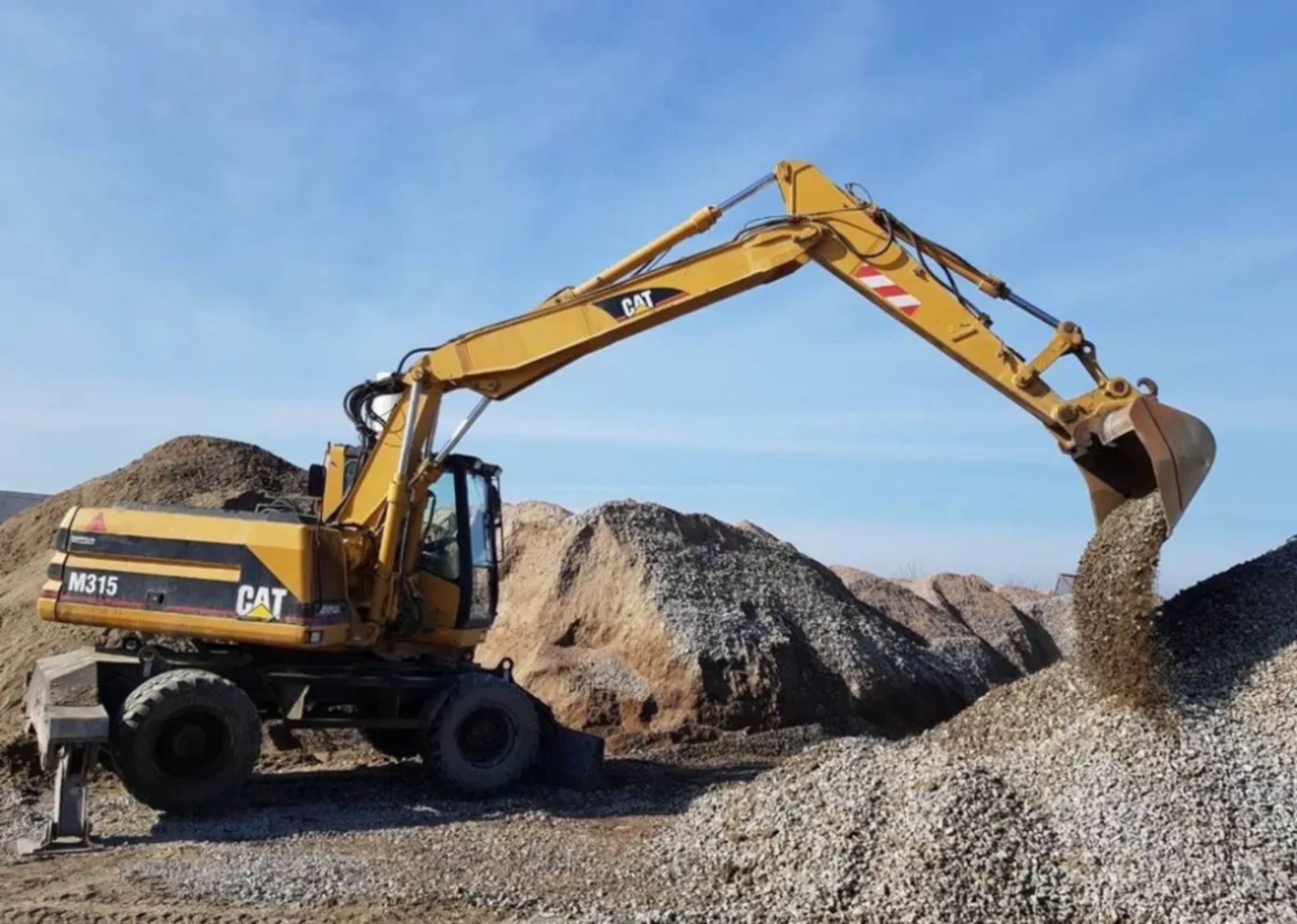 Колісний екскаватор Caterpillar M 315