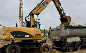 Колісний екскаватор CAT - M318