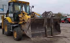 JCB з ковшем. Копання та планування