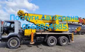 Автокран. Довжина основної стріли 24 м, додатковий подовжувач -7 м