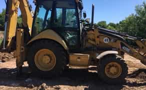 Экскаватор-погрузчик Cat.Услуги самосвала .