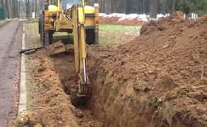 Риття траншей екскаватором