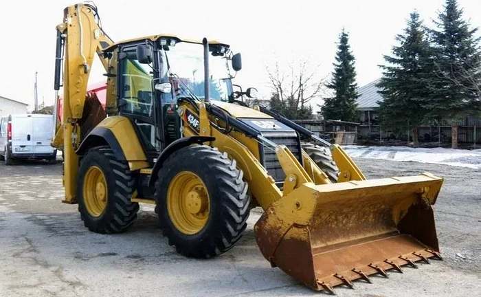 Екскаватор - навантажувач Екскаватор - навантажувач