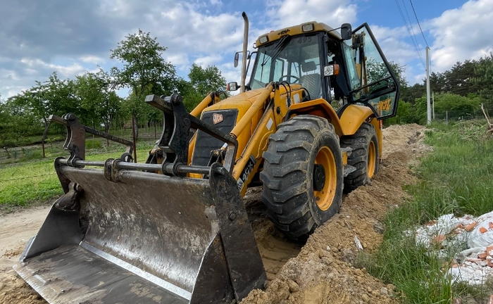 Екскаватор навантажувач Екскаватор навантажувач