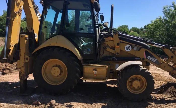 Экскаватор-погрузчик Cat.Услуги самосвала .