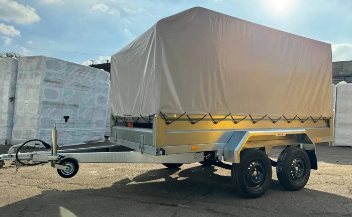 Причіп легковий двохосний Універсал 3000х1500 з високим тентом 2200см Причіп легковий двохосний Універсал 3000х1500 з високим тентом 2200см