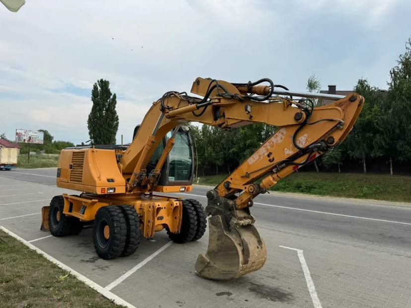 Повноповоротний екскаватор Case WX145