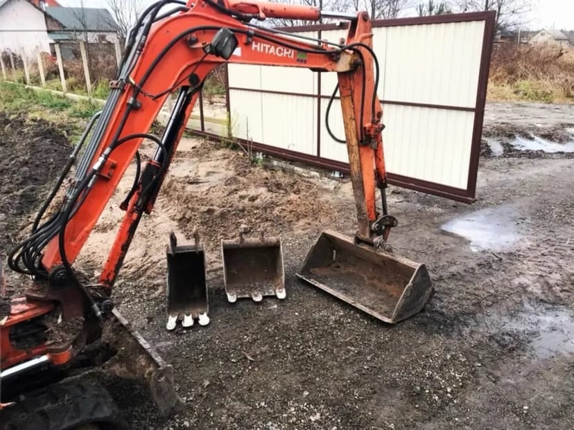 Міні - екскаватор Hitachi Construction Machinery.