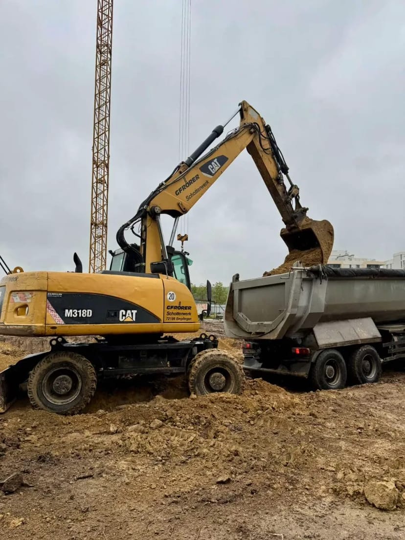 Колісний екскаватор CAT - M318