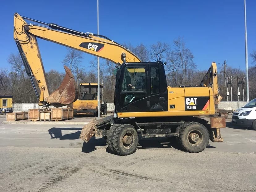 Колісний екскаватор CAT 315 Atlas